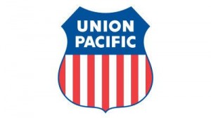 Union Pacific logo shield with blue uppper and red and white vertical striped lower